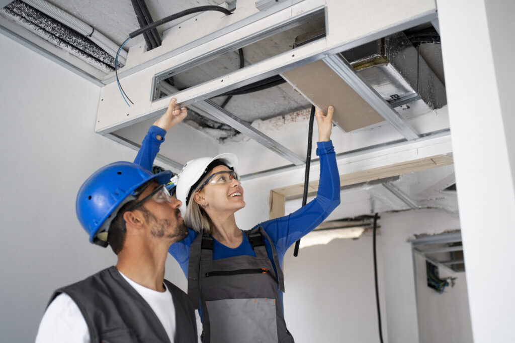 AC duct cleaning service in Dubai by professional HVAC technicians performing air conditioning duct cleaning and maintenance installation.
